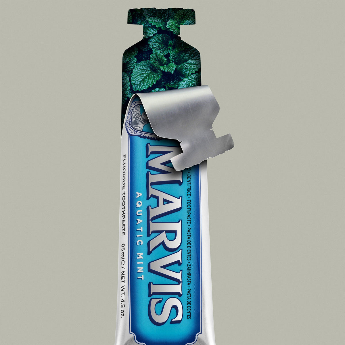Marvis Aquatic Mint Toothpaste with fresh mint leaves
